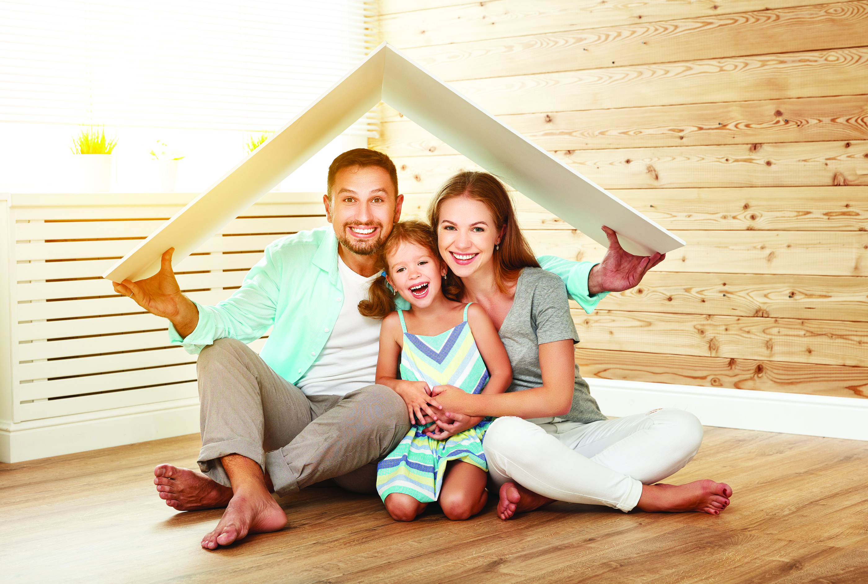 Stock Photo of Family sitting in wooden room